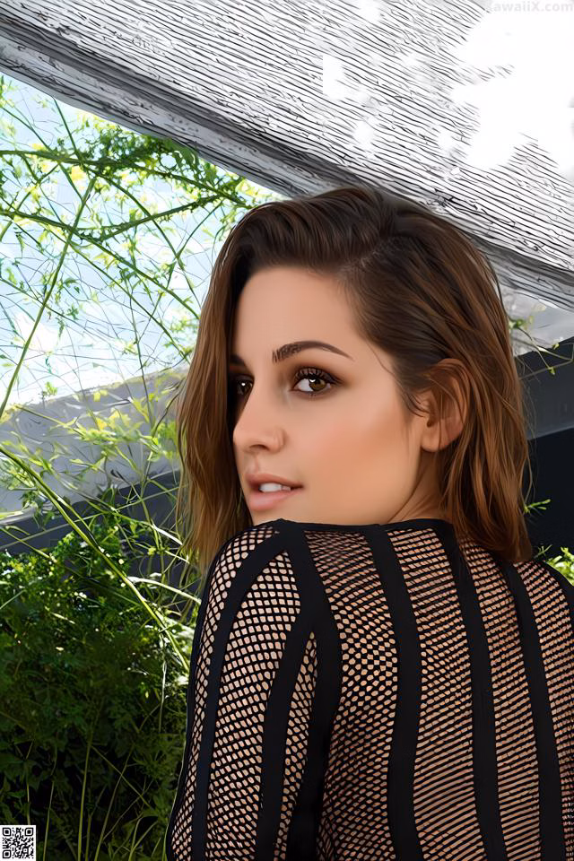 A woman in a black fishnet top looking out a window.